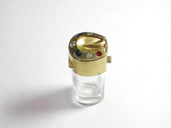 Perfumero de oro de 18k con diamantes, rubies y zafiros. Mellerio. 1930-1940.