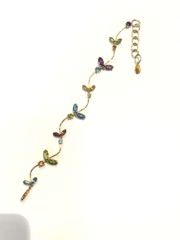 Pulsera de Sra. de TOUS en oro 18 Kts. con piedras color naturales.